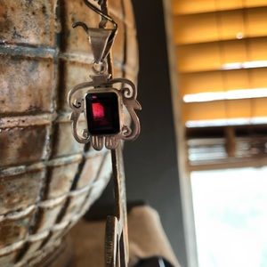 Sterling (marked) emerald-shaped garnet pendant